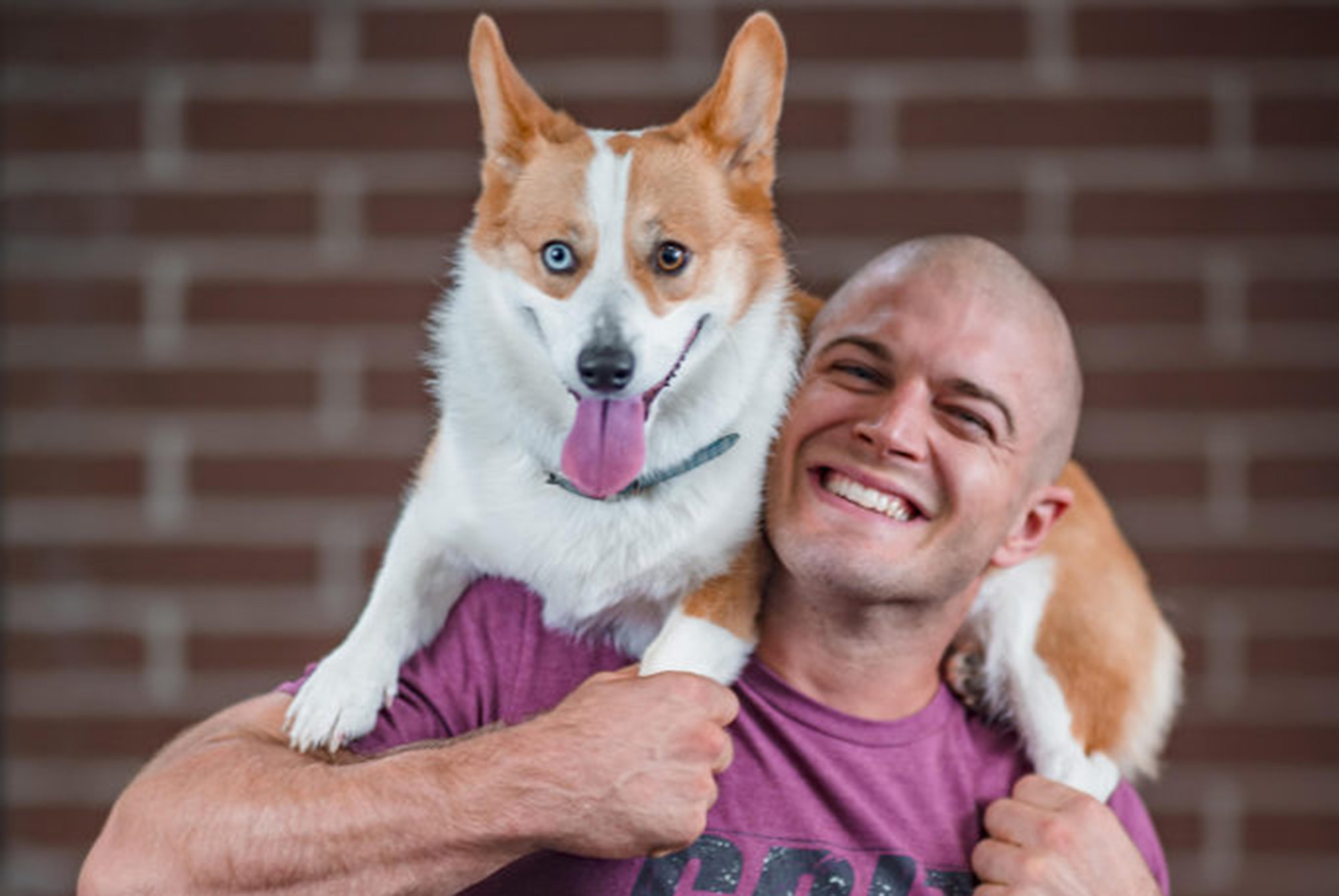 man holding dog talking about strength training program
